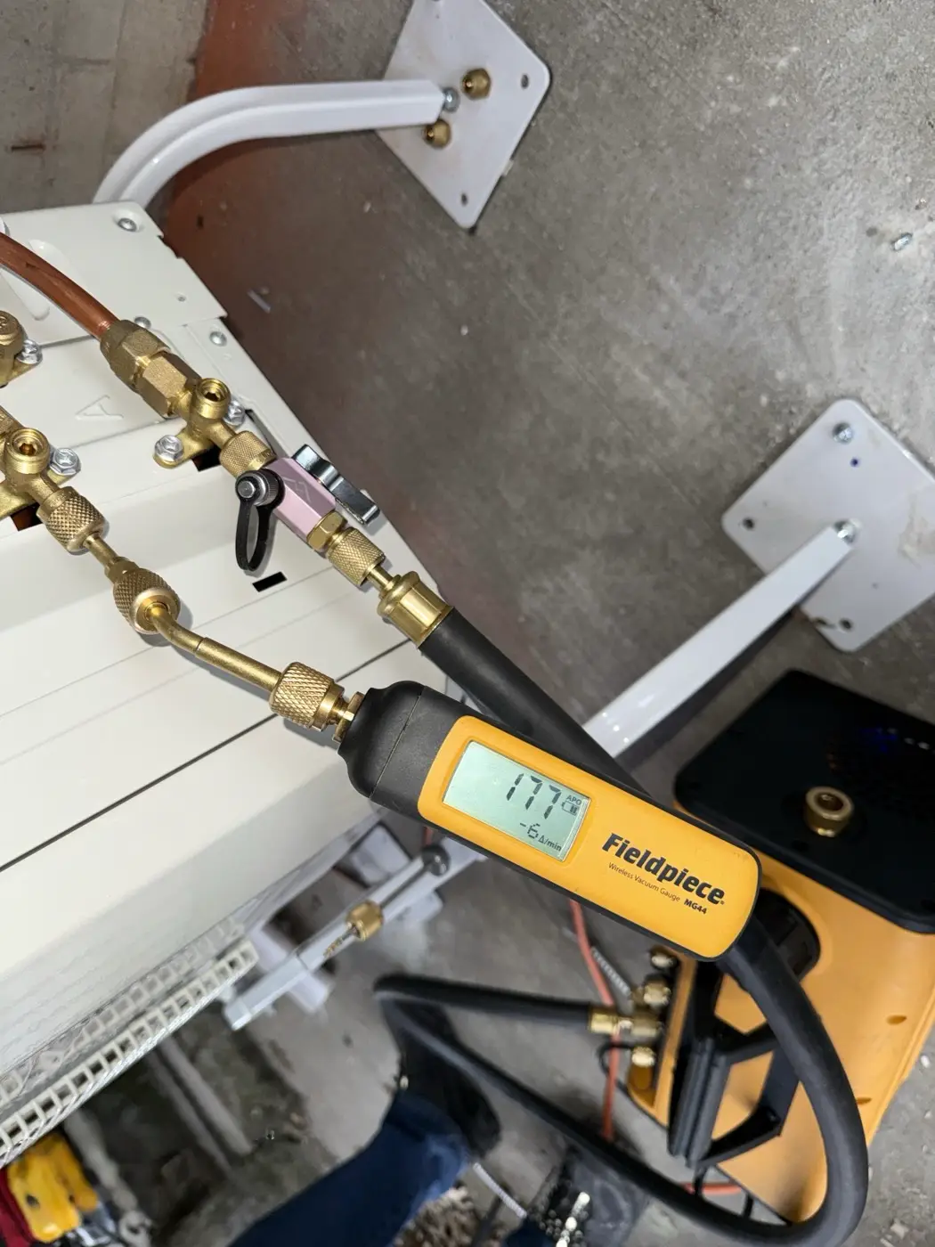 Pulling a vacuum on a mini-split condenser with a digital gauge during installation