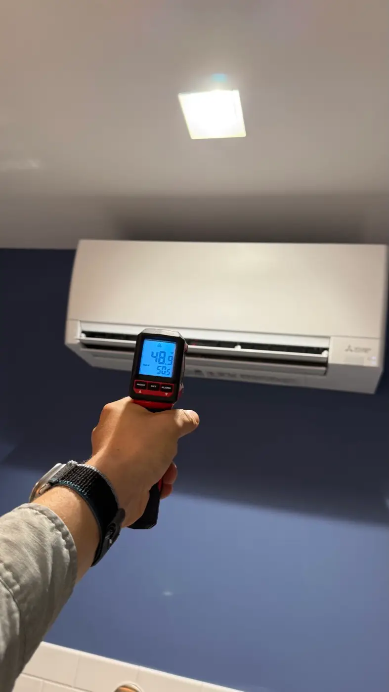Verifying cold supply-air temperature of a Mitsubishi wall unit after installation